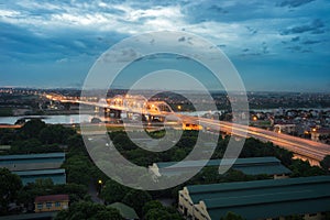 Aerial view of Tru bridge crossing Red River at twilight in Hanoi, Vietnam photo