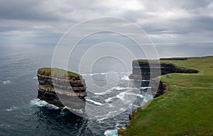 Aerial view of the Downpatrick Head sea stack and cliffs and coastline of northern County Mayo in Ireland