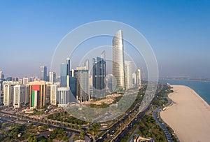 Aerial view of Downtown Abu Dhabi skyscrapers along the city beach on a sunny day, UAE