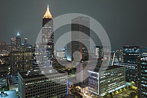 Aerial view of downtown district of Atlanta city in Georgia, USA. Brightly illuminated high skyscraper buildings in