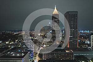 Aerial view of downtown district of Atlanta city in Georgia, USA. Brightly illuminated high skyscraper buildings in