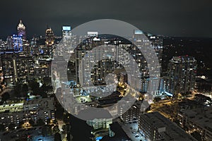 Aerial view of downtown district of Atlanta city in Georgia, USA. Brightly illuminated high skyscraper buildings in