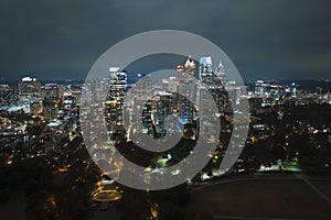 Aerial view of downtown district of Atlanta city in Georgia, USA. Brightly illuminated high skyscraper buildings in