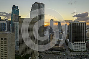 Aerial view of downtown district of of Miami Brickell in Florida, USA at sunset. High skyscraper buildings and street