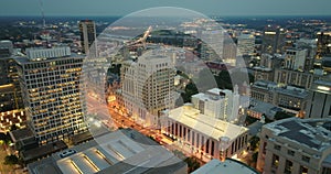 Aerial view of downtown district of Richmond city in Virginia, USA at night. Brightly illuminated high skyscraper