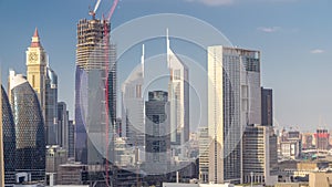 Aerial view on downtown and financial district in Dubai timelapse, United Arab Emirates with skyscrapers and highways.