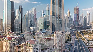 Aerial view on downtown and financial district in Dubai timelapse, United Arab Emirates with skyscrapers and highways.