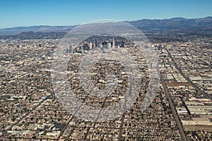 Aerial view of downtown Los Angeles skyline and mountains