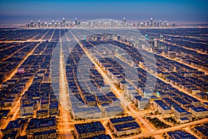 an aerial view of the downtown Los Angeles skyline before sunrise.