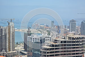 Aerial view of downtown Luanda, bay and Port of Luanda, marginal and central buildings, in Angola