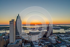 Aerial view of the downtown Mobile, Alabama cityscape and skyline urban waterfront at sunrise