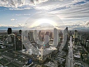 aerial view of downtown with road and city skyline on cloudy day