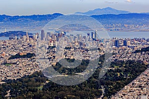 Aerial view of downtown San Francisco and Financial District sky scrapers flying over Golden Gate Park