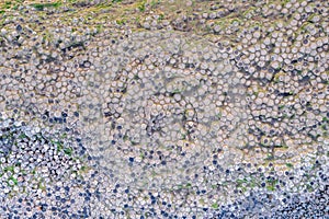 Aerial view with dozen of stones on Giants Causeway, the famous landmark on Northern Ireland UK