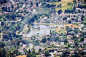 Aerial view of Dr. Robert Gross Groundwater Recharge Pond surrounded by a residential neighborhood, San Jose, South San Francisco