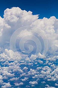 Aerial view of dramatic cloud formation and cityscape below