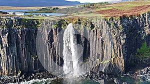 Aerial view of the dramatic coastline at the cliffs by Staffin with the famous Kilt Rock waterfall - Isle of Skye -