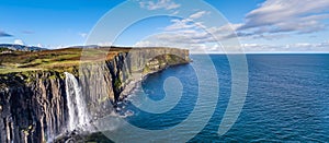 Aerial view of the dramatic coastline at the cliffs by Staffin with the famous Kilt Rock waterfall - Isle of Skye -