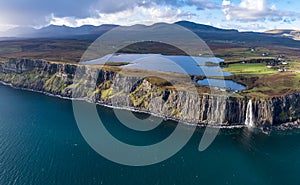 Aerial view of the dramatic coastline at the cliffs by Staffin with the famous Kilt Rock waterfall - Isle of Skye -