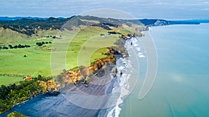 Aerial view on a dramatic Tasman coast line with cliffs and rocks near New Plymouth. Taranaki region, New Zealand.