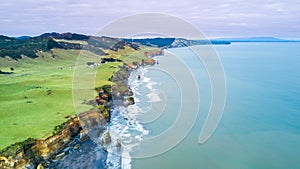 Aerial view on a dramatic Tasman coast line with cliffs and rocks near New Plymouth. Taranaki region, New Zealand.