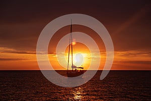 Aerial view from drone on boat shipping in sea, sunset