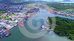 Aerial view Drone Camera of boats in Koh Sirey fishing port Phuket Thailand,fisherman boats at the harbor in Phuket province to tr