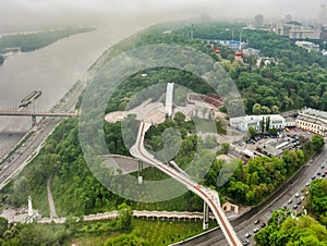 Aerial view from drone, early foggy morning, pedestrian-bicycle bridge in Kiev