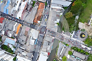 Aerial view Drone flying over phuket city Thailand.Drone over a street night market in Sunday at Phuket Town and Tourists walking