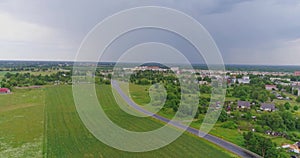 Aerial view of drone follow cars and trucks on wet road after rain is gone.