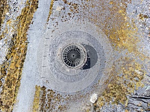 Aerial view from drone of industrial spooky dark mineshaft photo