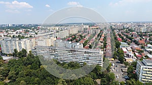 Aerial view from drone over blocks and green trees