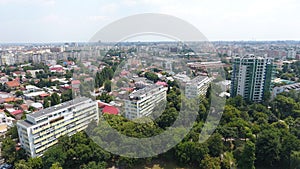 Aerial view from drone over blocks and green trees