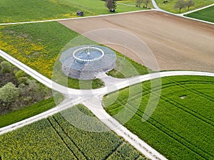 Aerial view by drone over the spring fields with a obsolete D-VOR