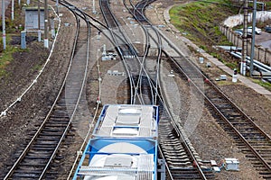 Aerial view from drone on railroad tracks next to the train platform