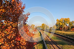 Aerial view from drone on railway road between trees Landscape background with steel rails Old forgotten rail track between