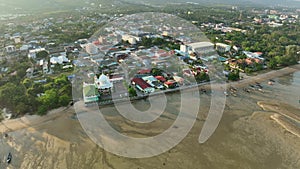 Aerial view Drone shot of light sunset or sunrise over mountains with seashore in Phuket thailand