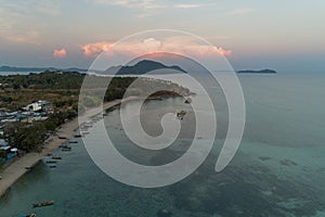 Aerial view drone shot of long tail boats at rawai beach in phuket Thailand sunset evening time