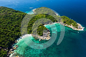 Aerial view drone shot ocean waves, Beautiful tropical beach and rocky coastline and beautiful forest. Nga Khin Nyo Gyee Island photo