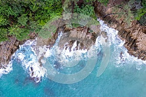 Aerial View Drone shot of waves crashing on seashore, Sea ocean background