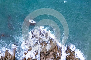 Aerial View Drone shot of waves crashing on seashore, Sea ocean background