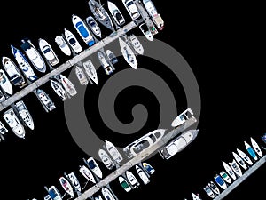 Aerial View by Drone of Yacht Club and Marina. Top view of yacht club. White boats in sea water. Marina dock yachts and small moto