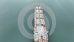 Aerial view of dry cargo ship. Bulk carrier cargo vessel. Ship logistic and transportation business industry.