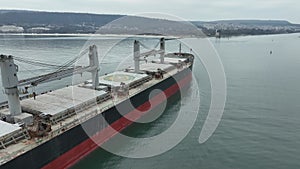 Aerial view of dry cargo ship. Bulk carrier cargo vessel. Ship logistic and transportation business industry.