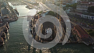 Aerial view of dry dock for ship repairs in port of Lisbon at sunset