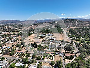 Aerial view of dry valley with houses and barn in Escondido, California photo