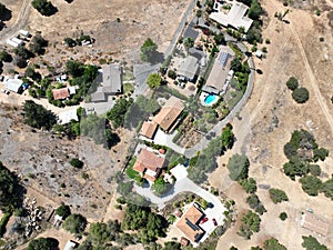Aerial view of dry valley with houses and barn in Escondido, California photo