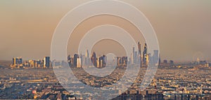 Aerial view of Dubai Downtown skyline and ferris wheel in United Arab Emirates or UAE. Financial district and business area in