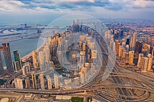 Aerial view of Dubai Downtown skyline, highway roads or street in United Arab Emirates or UAE. Financial district and business