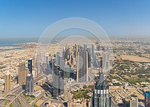 Aerial view of Dubai Downtown skyline, highway roads or street in United Arab Emirates or UAE. Financial district and business